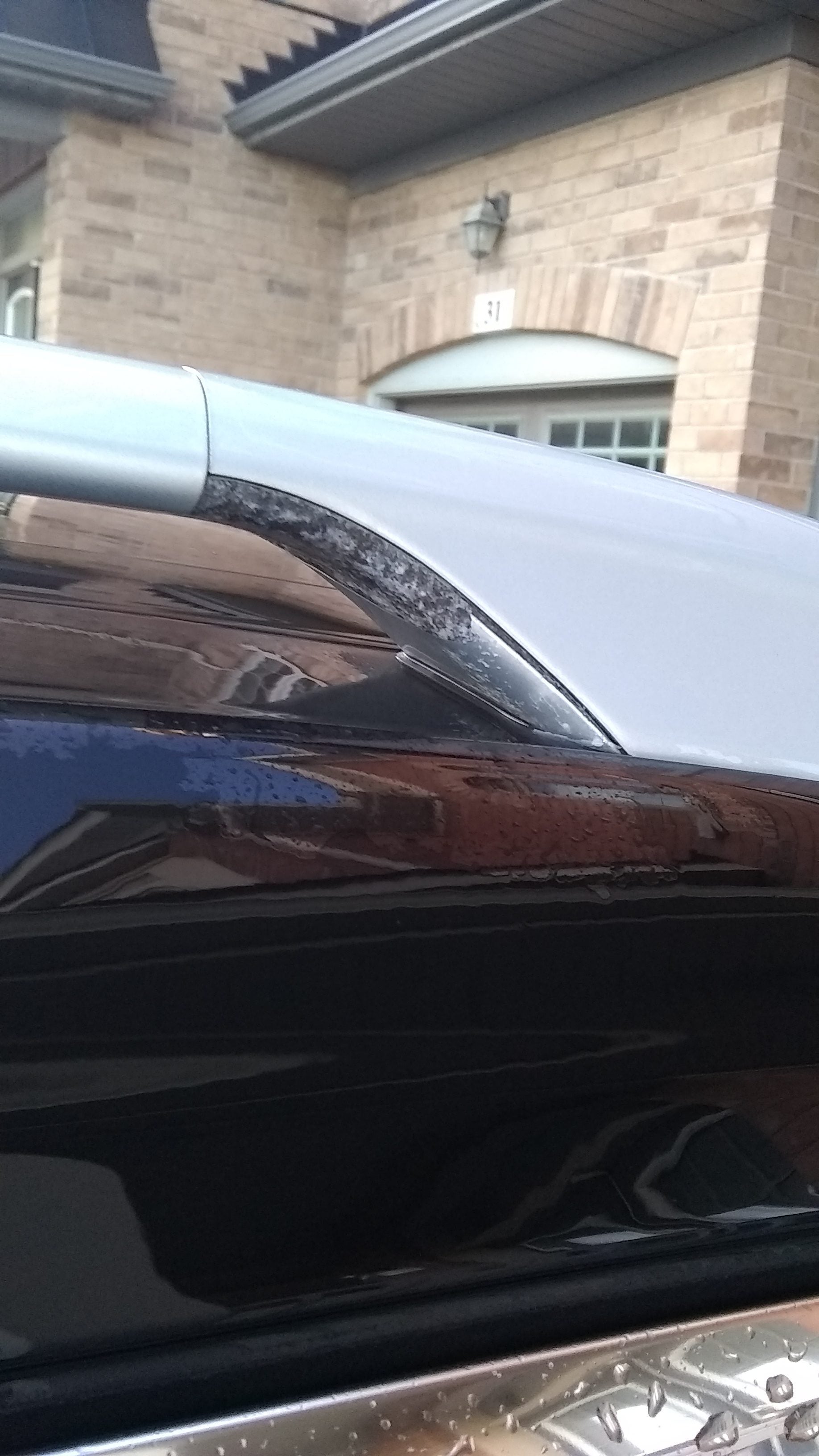 2014 Nissan Rogue roof rail silver paint peeling off